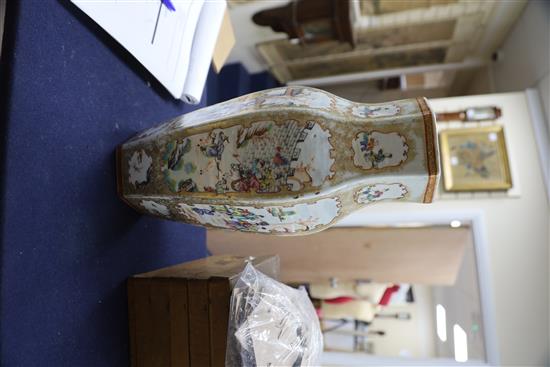 A Chinese famille rose mandarin hexagonal baluster vase, Qianlong period, H. 37.4cm, slight restoration to rim